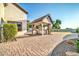Backyard featuring a covered kitchen area with a grill and extended countertop space at 10059 W Villa Lindo Dr, Peoria, AZ 85383