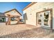 Covered outdoor dining area, exterior door, and a paver patio at 10059 W Villa Lindo Dr, Peoria, AZ 85383