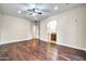 Bedroom with hardwood floors and en-suite access to a bathroom at 10059 W Villa Lindo Dr, Peoria, AZ 85383