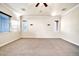 Bright bedroom with carpet, three windows, ceiling fan, and crown molding at 10059 W Villa Lindo Dr, Peoria, AZ 85383