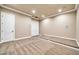 Carpeted bonus room with neutral paint and tiered platform at 10059 W Villa Lindo Dr, Peoria, AZ 85383