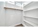 Walk-in closet with carpet, white walls, and a white shelving unit with a wooden rod at 10059 W Villa Lindo Dr, Peoria, AZ 85383