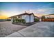 Landscaped yard with brick driveway, stucco exterior and view of entry gate at 10059 W Villa Lindo Dr, Peoria, AZ 85383