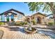 The stone gatehouse and fountain creates a welcoming entry to this charming home at 10059 W Villa Lindo Dr, Peoria, AZ 85383