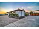 House featuring a brick driveway and a view of the three car garage at 10059 W Villa Lindo Dr, Peoria, AZ 85383