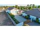 Aerial view of the home's three car garage, outdoor kitchen, and back yard at 10059 W Villa Lindo Dr, Peoria, AZ 85383