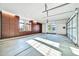 A spacious garage featuring ample storage cabinets, natural light, and a concrete floor at 10059 W Villa Lindo Dr, Peoria, AZ 85383