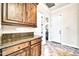 Hallway with views of the powder room and laundry room at 10059 W Villa Lindo Dr, Peoria, AZ 85383