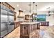 Spacious kitchen with custom wood cabinets, granite countertops, and stainless steel appliances at 10059 W Villa Lindo Dr, Peoria, AZ 85383