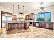 Gourmet kitchen with stainless steel appliances, custom cabinets, and granite countertops at 10059 W Villa Lindo Dr, Peoria, AZ 85383