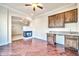 Inviting living room with hardwood floors, fireplace, and a built-in bar area at 10059 W Villa Lindo Dr, Peoria, AZ 85383