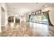 Bright open living room with tile floors, and seamless access to outdoor spaces at 10059 W Villa Lindo Dr, Peoria, AZ 85383