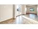 Bright living room with tile floors, double French doors, and a large window at 10059 W Villa Lindo Dr, Peoria, AZ 85383