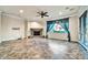 Cozy living area with tile flooring and a stone fireplace, bathed in natural light at 10059 W Villa Lindo Dr, Peoria, AZ 85383