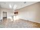 The expansive living room boasts recessed lighting and neutral tiling leading to another room at 10059 W Villa Lindo Dr, Peoria, AZ 85383