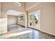Bright open living area with tiled floor and access to the yard through French doors at 10059 W Villa Lindo Dr, Peoria, AZ 85383