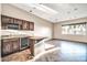 Entertainer's dream: a wet bar with a wine fridge, granite countertop and a view at 10059 W Villa Lindo Dr, Peoria, AZ 85383