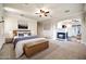 Spacious main bedroom with a fireplace, seating area, and a large bed creates a luxurious feel at 10059 W Villa Lindo Dr, Peoria, AZ 85383