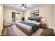 Serene main bedroom featuring a wooden bed frame, blue accents, and private access to the outdoors at 10059 W Villa Lindo Dr, Peoria, AZ 85383