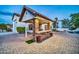 Outdoor kitchen and bar area with stone accents, perfect for entertaining by the pool at 10059 W Villa Lindo Dr, Peoria, AZ 85383