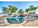 Backyard pool featuring a grotto with a slide in a well-maintained outdoor space at 10059 W Villa Lindo Dr, Peoria, AZ 85383