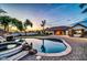 Luxurious pool area with a waterfall feature and spacious patio, perfect for outdoor relaxation at 10059 W Villa Lindo Dr, Peoria, AZ 85383