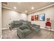 Home theater room with tiered seating, individual recliners, and a popcorn machine creates an immersive experience at 10059 W Villa Lindo Dr, Peoria, AZ 85383