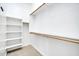 Empty walk-in closet features shelving and hanging rods for ample storage space at 10059 W Villa Lindo Dr, Peoria, AZ 85383