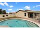Private backyard featuring a sparkling swimming pool and covered patio perfect for relaxing at 10817 W Wilshire Dr, Avondale, AZ 85392
