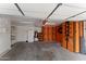 Spacious garage interior with storage system, shelving, and lighting at 10817 W Wilshire Dr, Avondale, AZ 85392