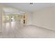Spacious living room with tiled floors, recessed lighting, and access to the pool at 10817 W Wilshire Dr, Avondale, AZ 85392