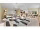 Open-concept living space with tile floors, breakfast bar, and neutral finishes at 10817 W Wilshire Dr, Avondale, AZ 85392