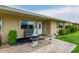 Charming front entry with manicured landscaping, attractive bench seating, and decorative fountain at 11122 W Desert Butte Dr, Sun City, AZ 85351