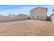Large backyard with gravel and block fencing, providing privacy and a blank canvas for landscaping at 148 E Douglas Ave, Coolidge, AZ 85128