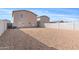 A backyard with gravel and a fence; perfect for customization and relaxation outdoors at 148 E Douglas Ave, Coolidge, AZ 85128