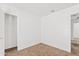 Empty bedroom featuring carpet and two doorways at 148 E Douglas Ave, Coolidge, AZ 85128