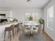 Bright dining area with a modern table set perfect for Gathering meals and entertaining guests at 148 E Douglas Ave, Coolidge, AZ 85128