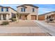 Charming two-story home featuring a well-maintained yard and a welcoming front entrance at 148 E Douglas Ave, Coolidge, AZ 85128