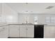 Bright kitchen featuring granite counters, stainless steel sink, and ample cabinet space at 148 E Douglas Ave, Coolidge, AZ 85128