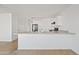 Kitchen area with breakfast bar, ample counter space, and plenty of natural light at 148 E Douglas Ave, Coolidge, AZ 85128
