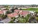 Gorgeous aerial view of a well-maintained home and yard near a golf course in a desert community at 15948 W Sheila Ln, Goodyear, AZ 85395