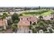 Beautiful aerial view of a home situated on a well-maintained golf course, surrounded by lush landscaping at 15948 W Sheila Ln, Goodyear, AZ 85395