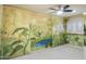 Bedroom with scenic wall mural, a ceiling fan, and tiled flooring at 15948 W Sheila Ln, Goodyear, AZ 85395