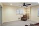 Bedroom with natural light, a ceiling fan, an armchair, and built-in shelving at 15948 W Sheila Ln, Goodyear, AZ 85395