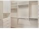 A well-organized walk-in closet with multiple shelves and ample hanging space at 15948 W Sheila Ln, Goodyear, AZ 85395