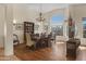 Bright dining room features a chandelier and large windows offering stunning views at 15948 W Sheila Ln, Goodyear, AZ 85395
