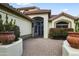 Beautiful home with a gated entrance and manicured flower beds creating a grand arrival at 15948 W Sheila Ln, Goodyear, AZ 85395