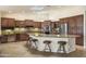 Gourmet kitchen with granite countertops, stainless steel appliances, and ample cabinet space at 15948 W Sheila Ln, Goodyear, AZ 85395