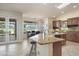 A kitchen featuring granite countertops, tile floors and a view of the golf course at 15948 W Sheila Ln, Goodyear, AZ 85395
