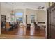 Open living space with views of the dining area and a fireplace at 15948 W Sheila Ln, Goodyear, AZ 85395